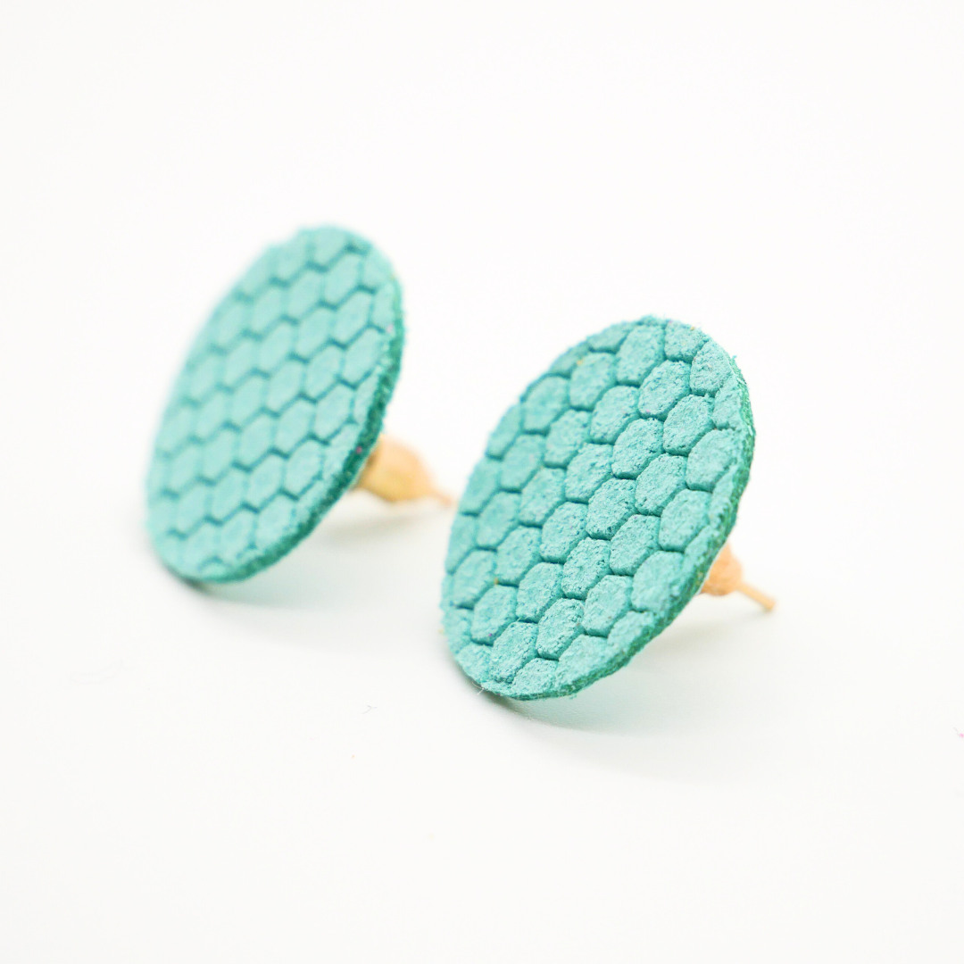Bold statement earrings in vibrant colors, lightweight and comfortable for all-day wear, handcrafted sustainable leather earrings, eco-friendly jewelry with modern designs, festive holiday earrings perfect for gifting, celestial sun and moon motifs, boho styles with earthy tones, playful Dalmatian print earrings, minimalist earrings styled for the season, bold designs from a small, women-owned business, gift-worthy feather-light earrings, sustainable and recycled leather for eco-conscious fashion