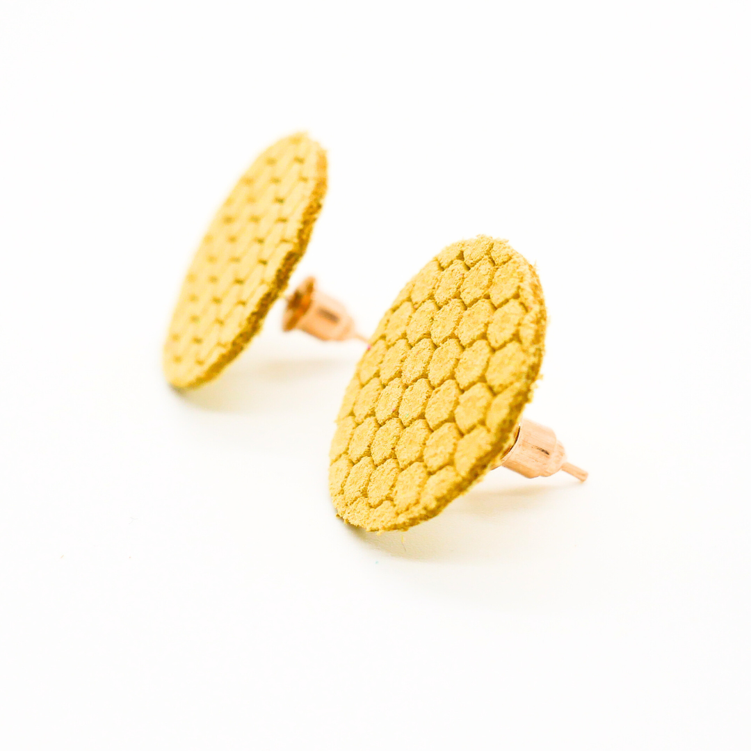 Bold statement earrings in vibrant colors, lightweight and comfortable for all-day wear, handcrafted sustainable leather earrings, eco-friendly jewelry with modern designs, festive holiday earrings perfect for gifting, celestial sun and moon motifs, boho styles with earthy tones, playful Dalmatian print earrings, minimalist earrings styled for the season, bold designs from a small, women-owned business, gift-worthy feather-light earrings, sustainable and recycled leather for eco-conscious fashion