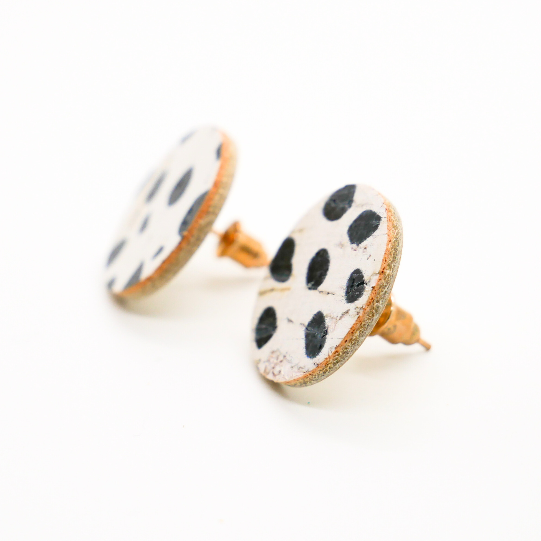 Bold statement earrings in vibrant colors, lightweight and comfortable for all-day wear, handcrafted sustainable leather earrings, eco-friendly jewelry with modern designs, festive holiday earrings perfect for gifting, celestial sun and moon motifs, boho styles with earthy tones, playful Dalmatian print earrings, minimalist earrings styled for the season, bold designs from a small, women-owned business, gift-worthy feather-light earrings, sustainable and recycled leather for eco-conscious fashion