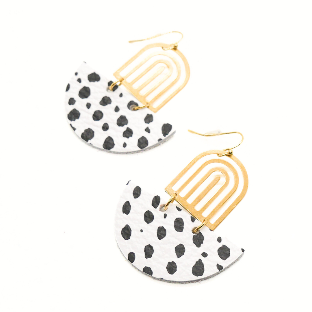 Bold statement earrings in vibrant colors, lightweight and comfortable for all-day wear, handcrafted sustainable leather earrings, eco-friendly jewelry with modern designs, festive holiday earrings perfect for gifting, celestial sun and moon motifs, boho styles with earthy tones, playful Dalmatian print earrings, minimalist earrings styled for the season, bold designs from a small, women-owned business, gift-worthy feather-light earrings, sustainable and recycled leather for eco-conscious fashion