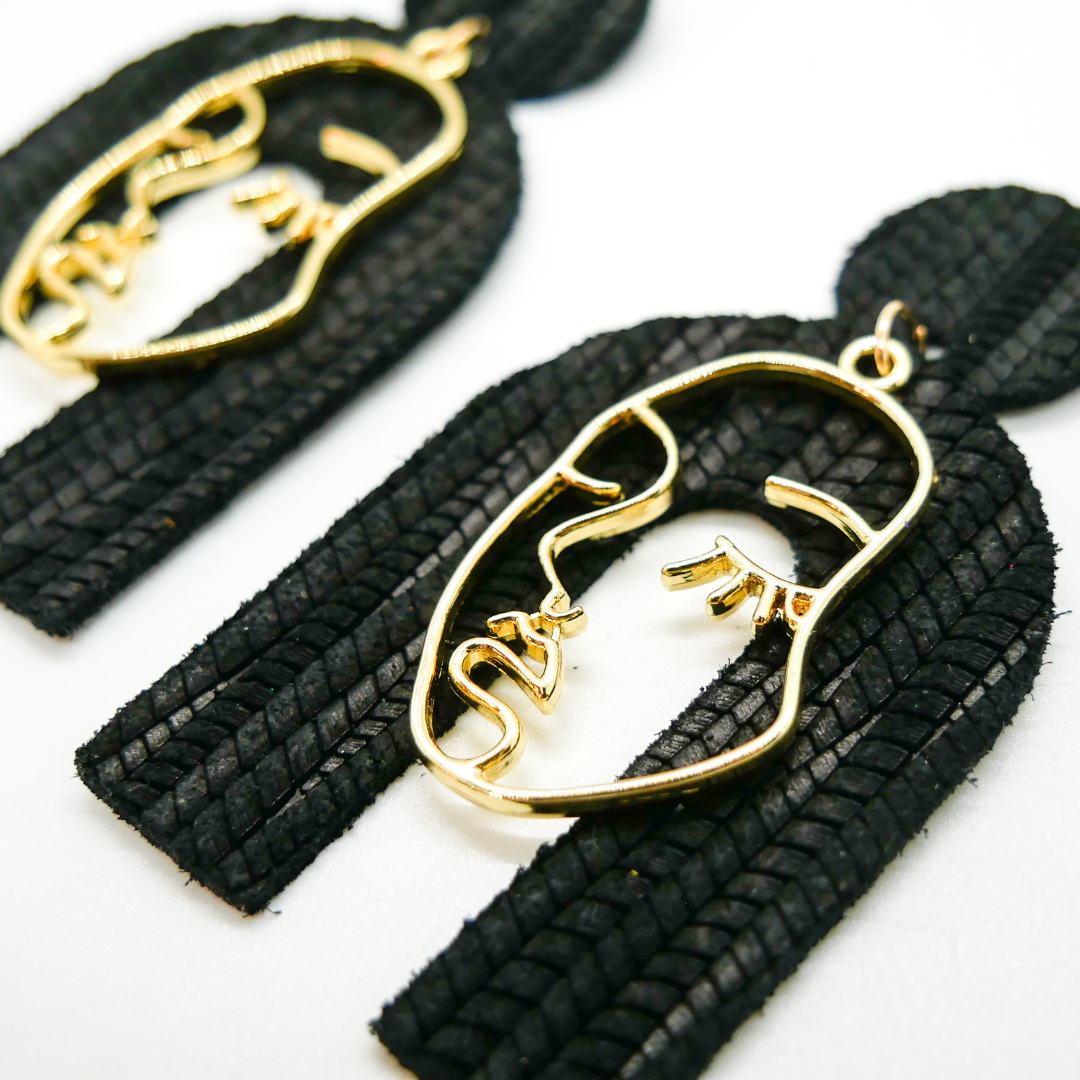 Bold statement earrings in vibrant colors, lightweight and comfortable for all-day wear, handcrafted sustainable leather earrings, eco-friendly jewelry with modern designs, festive holiday earrings perfect for gifting, celestial sun and moon motifs, boho styles with earthy tones, playful Dalmatian print earrings, minimalist earrings styled for the season, bold designs from a small, women-owned business, gift-worthy feather-light earrings, sustainable and recycled leather for eco-conscious fashion
