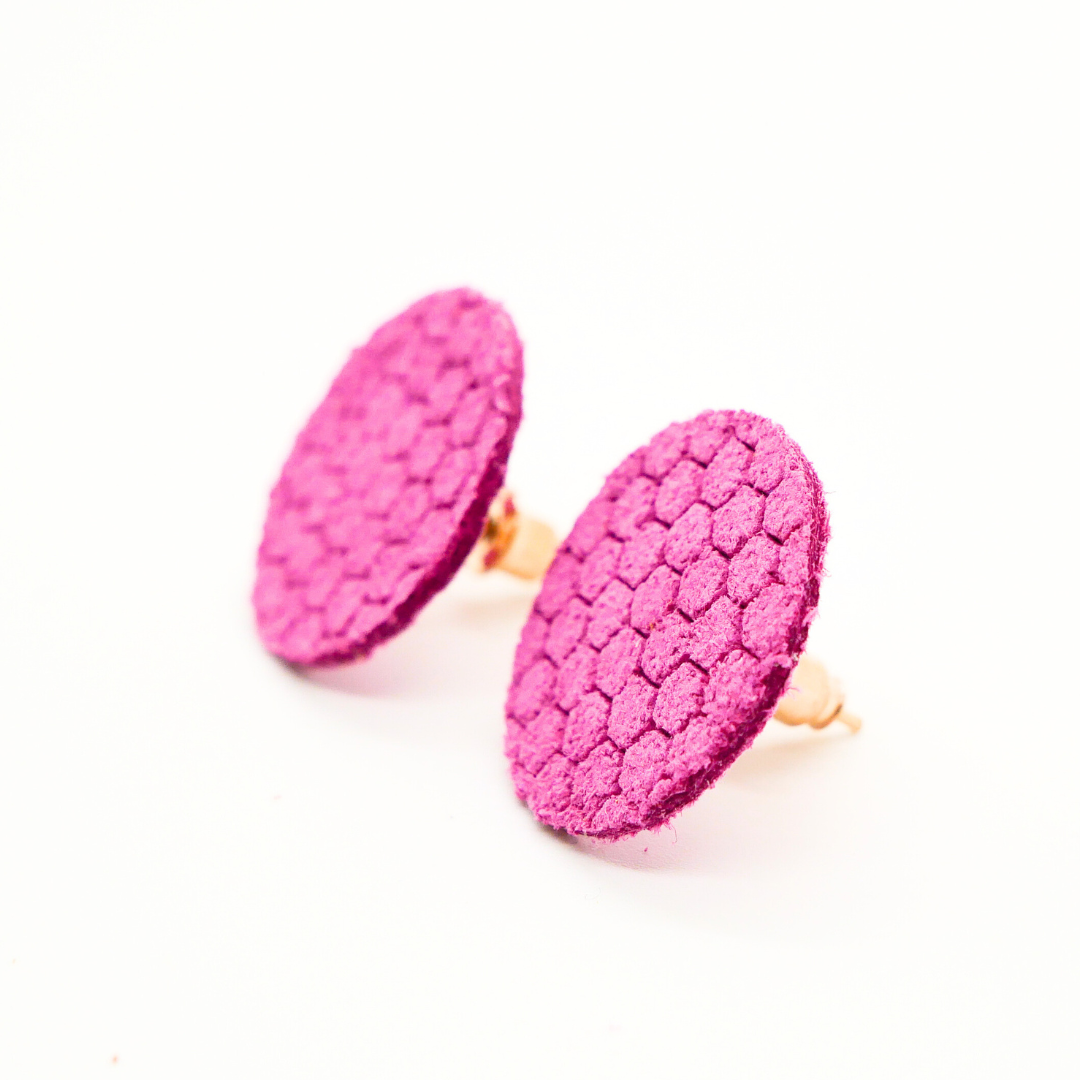 Bold statement earrings in vibrant colors, lightweight and comfortable for all-day wear, handcrafted sustainable leather earrings, eco-friendly jewelry with modern designs, festive holiday earrings perfect for gifting, celestial sun and moon motifs, boho styles with earthy tones, playful Dalmatian print earrings, minimalist earrings styled for the season, bold designs from a small, women-owned business, gift-worthy feather-light earrings, sustainable and recycled leather for eco-conscious fashion