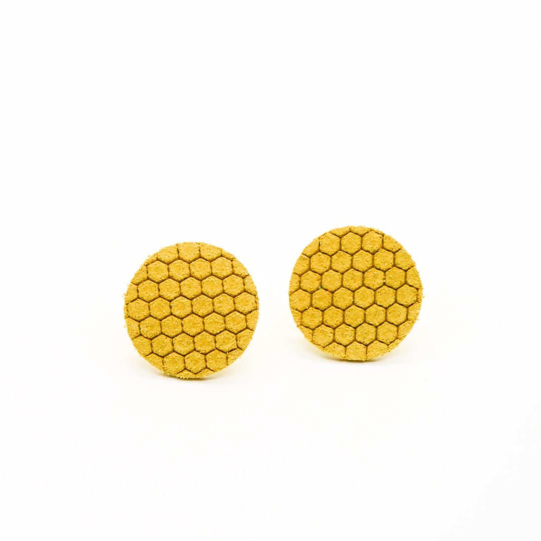 Bold statement earrings in vibrant colors, lightweight and comfortable for all-day wear, handcrafted sustainable leather earrings, eco-friendly jewelry with modern designs, festive holiday earrings perfect for gifting, celestial sun and moon motifs, boho styles with earthy tones, playful Dalmatian print earrings, minimalist earrings styled for the season, bold designs from a small, women-owned business, gift-worthy feather-light earrings, sustainable and recycled leather for eco-conscious fashion