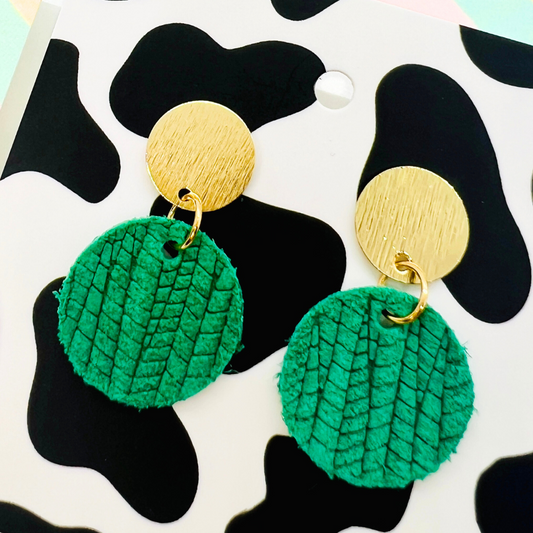 Bold statement earrings in vibrant colors, lightweight and comfortable for all-day wear, handcrafted sustainable leather earrings, eco-friendly jewelry with modern designs, festive holiday earrings perfect for gifting, celestial sun and moon motifs, boho styles with earthy tones, playful Dalmatian print earrings, minimalist earrings styled for the season, bold designs from a small, women-owned business, gift-worthy feather-light earrings, sustainable and recycled leather for eco-conscious fashion
