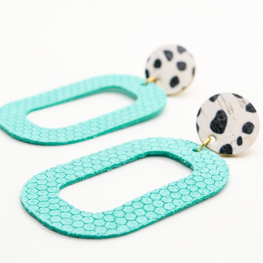 
Bold statement earrings in vibrant colors, lightweight and comfortable for all-day wear, handcrafted sustainable leather earrings, eco-friendly jewelry with modern designs, festive holiday earrings perfect for gifting, celestial sun and moon motifs, boho styles with earthy tones, playful Dalmatian print earrings, minimalist earrings styled for the season, bold designs from a small, women-owned business, gift-worthy feather-light earrings, sustainable and recycled leather for eco-conscious fashion