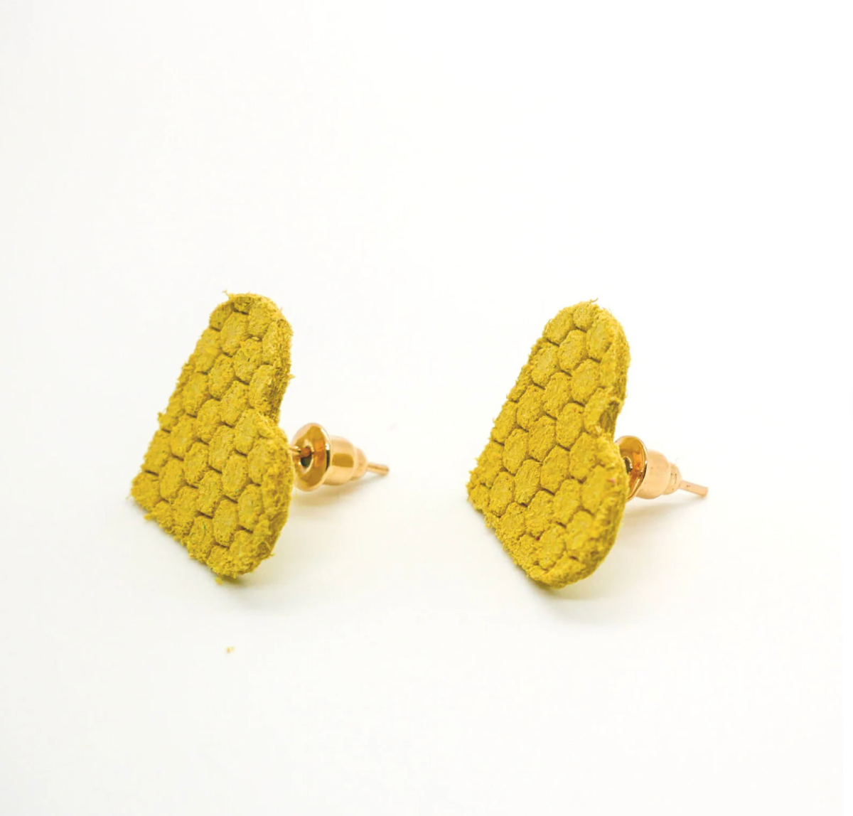 Bold statement earrings in vibrant colors, lightweight and comfortable for all-day wear, handcrafted sustainable leather earrings, eco-friendly jewelry with modern designs, festive holiday earrings perfect for gifting, celestial sun and moon motifs, boho styles with earthy tones, playful Dalmatian print earrings, minimalist earrings styled for the season, bold designs from a small, women-owned business, gift-worthy feather-light earrings, sustainable and recycled leather for eco-conscious fashion