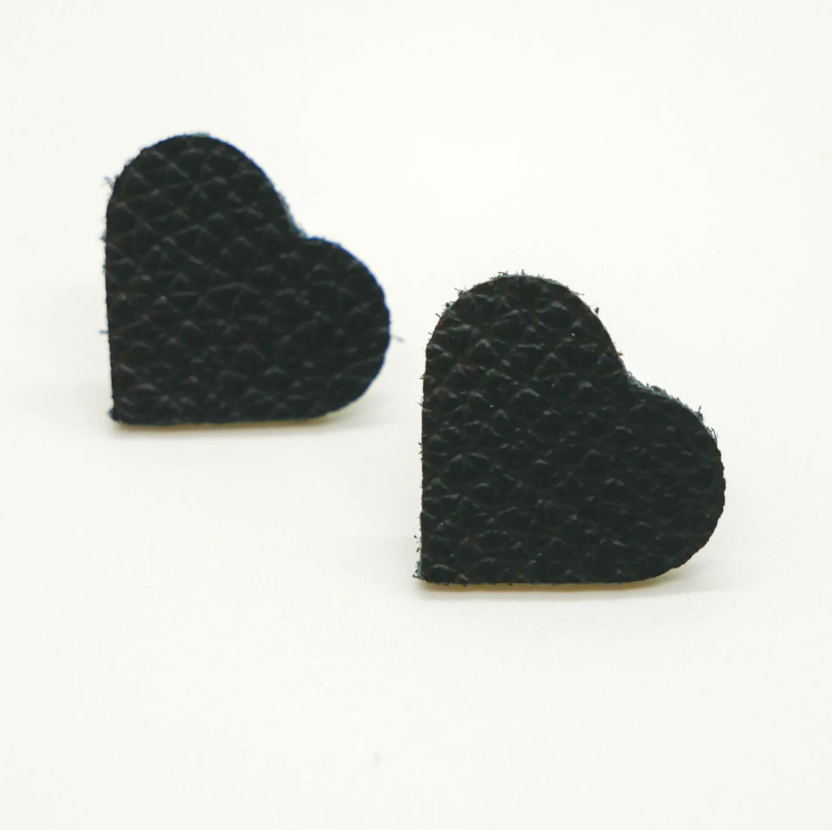 Bold statement earrings in vibrant colors, lightweight and comfortable for all-day wear, handcrafted sustainable leather earrings, eco-friendly jewelry with modern designs, festive holiday earrings perfect for gifting, celestial sun and moon motifs, boho styles with earthy tones, playful Dalmatian print earrings, minimalist earrings styled for the season, bold designs from a small, women-owned business, gift-worthy feather-light earrings, sustainable and recycled leather for eco-conscious fashion